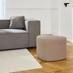 SWEEEK - Tabouret. Pouf en forme de galet en tissu greige. Tao l 60 x p 44 x h 40cm